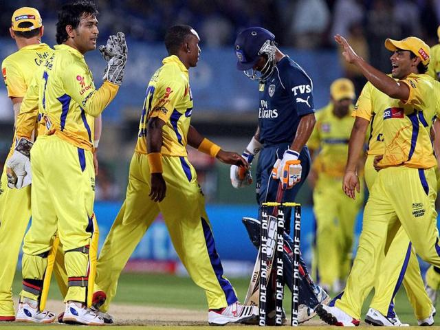 Chennai Super Kings Captain MS Dhoni with team mates celebrates the wicket of Deccan Chargers DJ Harris during their IPL-5 match in Visakhapatnam. (PTI Photo/Ashok Bhaumik)