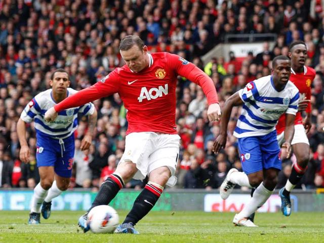 Manchester United's Wayne Rooney scores a penalty against Queens Park Rangers during their English Premier League match at Old Trafford in Manchester. Reuters