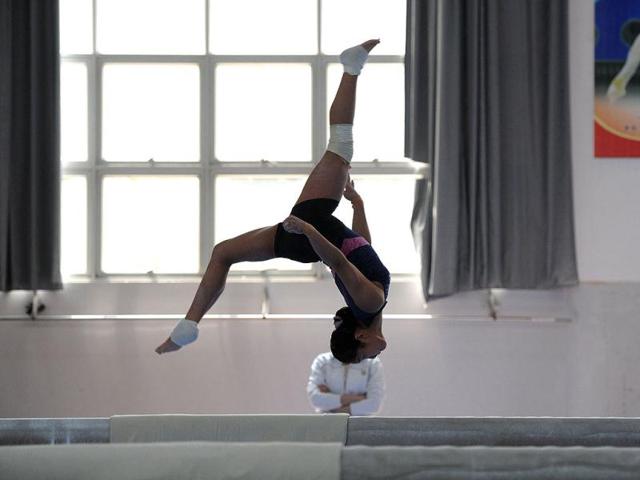 Young Chinese gymnast trains at a special sport school in Hefei, east China's Anhui province. Potential gymnasts embark on a gruelling schedule which aims to create champions. AFP photo