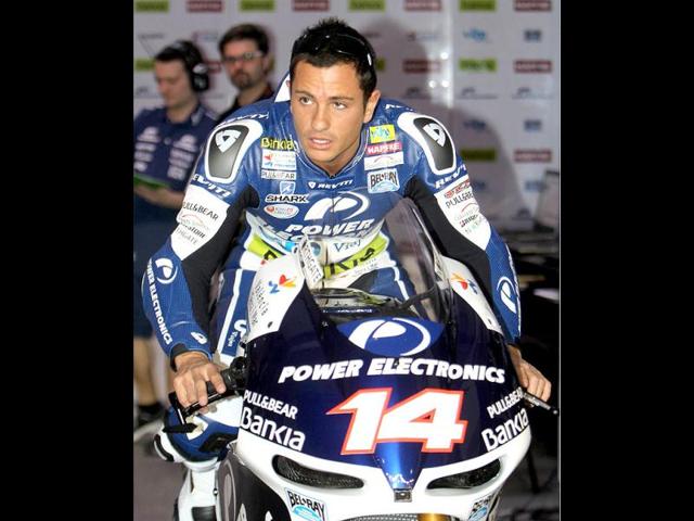 Power Electronics Aspar rider Randy De Puniet of France waits to take part in the qualifying practice session at the Losail International Circuit in Doha. AFP