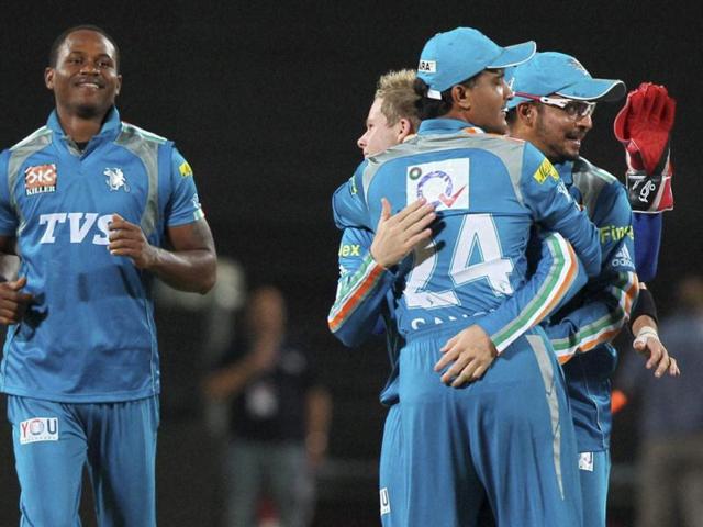 Pune Warriors captain S Ganguly celebrates with teammates the dismissal of Adam Gilchrist during the IPL match against Kings XI Punjab in Pune. PTI
