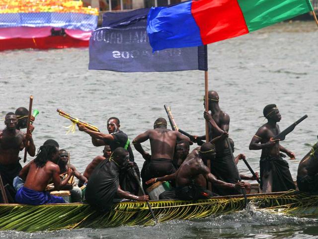 A group of Ijaw youths, an ethnic group of Nigeria's oil-rich Niger Delta, dress up and pretend to be militants in Lagos, Nigeria. Organizers held a boat regatta Sunday as part of the ongoing Lagos Carnival. The carnival will come to its height Monday as dancers and masquerades walk through the streets of Lagos' two main islands. AP Photo/Jon Gambrell