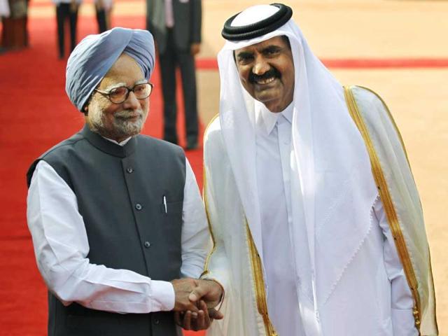Manmohan Singh, left, greets the Emir of Qatar, Sheikh Hamad bin Khalifa Al Thani, during the Emir's ceremonial reception at the Indian Presidential palace in New Delhi. AP/Saurabh Das
