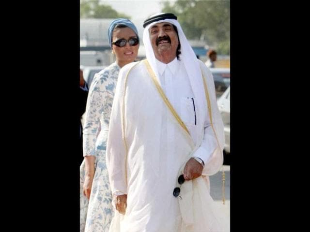 Emir of Qatar Sheikh Hamad Bin Khalifa Al-Thani arrives with his wife Sheikh Moza Bint Nasser at AFS Palam in New Delhi. PTI/Subhav Shukla