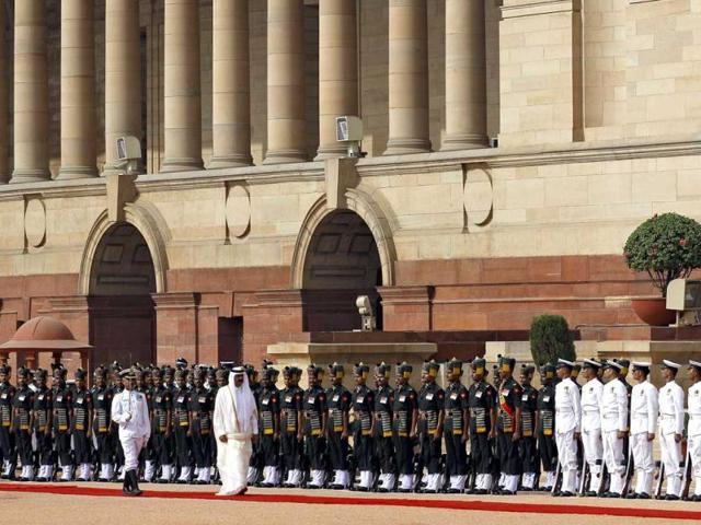 Qatar's emir, Sheikh Hamad bin Khalifa Al Thani inspects a guard of honour during his ceremonial reception at the Presidential Palace in New Delhi. AP/Saurabh Das