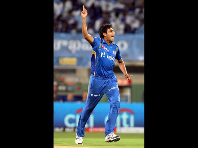 Mumbai Indians' Munaf Patel celebrates a dismissal of Deccan Chargers' Parthiv Patel during the IPL match in Visakhapatnam. (PTI Photo)