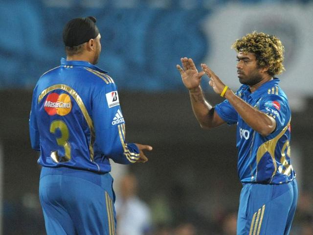 Latish Malinga celebrates with captain Harbhajan Singh the wicket of Deccan Chargers batsman Shikar Dhawan during the IPL match between Deccan Chargers and Mumbai Indians at Dr YS Rajasekhara Reddy Cricket Stadium. (AFP Photo)