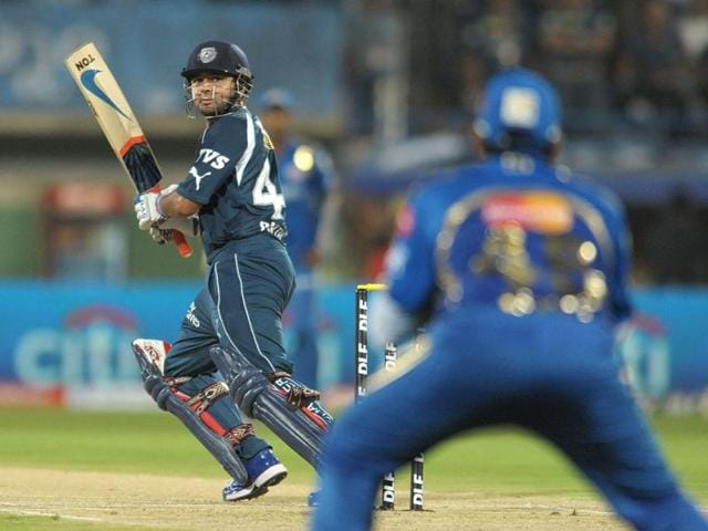 Parthiv Patel looks at the catch taken by Mumbai Indians fielder Rohit Sharma at Dr YS Rajasekhara Reddy Cricket Stadium in Visakhapatnam. (AFP Photo)