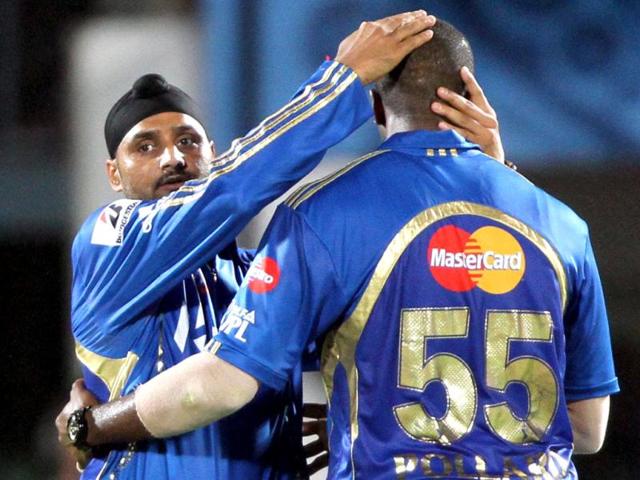 Harbhajan Singh, the captain of Mumbai Indians, congratlates bowler Pollard during the match against Deccan Chargers in the IPL 5 at YSR Stadium, Vishakhapatnama. HT Photo/Subhendu Ghosh.