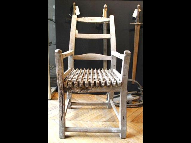 A torture instrument on display during the "Peines et chatiments d'autrefois" (Penalties And Punishments From Ancient Times) exhibition at the Fernand Meyssonnier Museum in the Hotel Salomon de Rothschild. (AFP Photo)