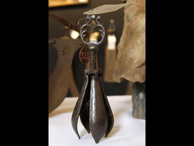 A picture shows a torture instrument on display during the "Peines et chatiments d'autrefois" (Penalties And Punishments From Ancient Times) exhibition at the Fernand Meyssonnier Museum in the Hotel Salomon de Rothschild, Paris. (AFP Photo)
