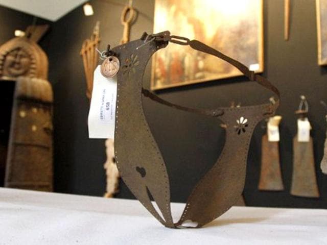 A picture taken in Paris shows a chastity belt on display during the "Peines et chatiments d'autrefois" (Penalties And Punishments From Ancient Times) exhibition at the Fernand Meyssonnier Museum in the Hotel Salomon de Rothschild. (AFP Photo)
