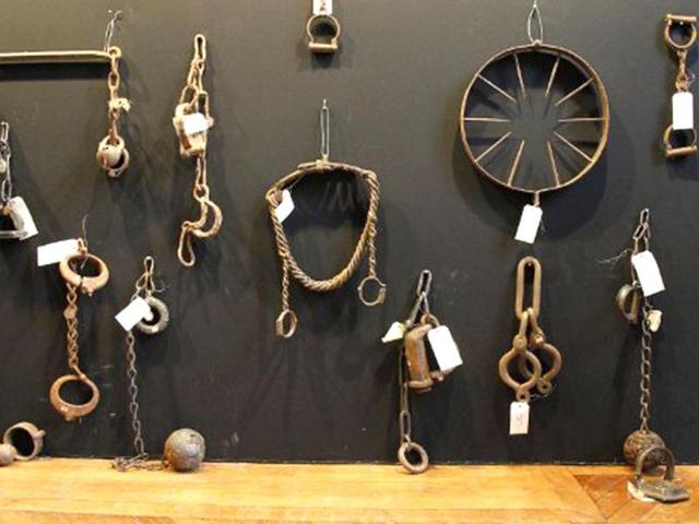 A picture taken in Paris shows torture instruments on display during the "Peines et chatiments d'autrefois" (Penalties And Punishments From Ancient Times) exhibition at the Fernand Meyssonnier Museum in the Hotel Salomon de Rothschild. (AFP Photo)