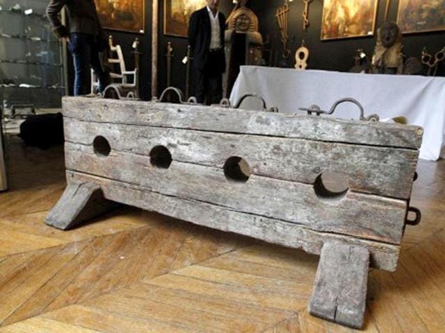 A picture taken in Paris shows a torture instrument on display during the "Peines et chatiments d'autrefois" (Penalties And Punishments From Ancient Times) exhibition at the Fernand Meyssonnier Museum in the Hotel Salomon de Rothschild. (AFP Photo)