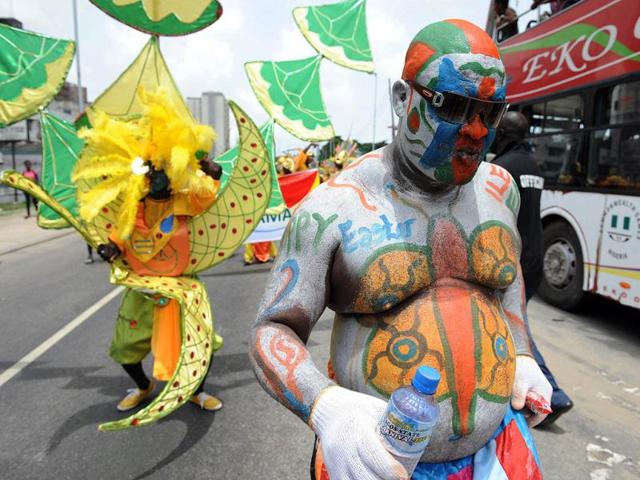 A man dances in a procession during the yearly Lagos carnival. The yearly Lagos carnival to celebrate the Easter festival and the rich cultural heritage of of the state was held in Lagos metropolis. AFP PHOTO / PIUS UTOMI EKPE