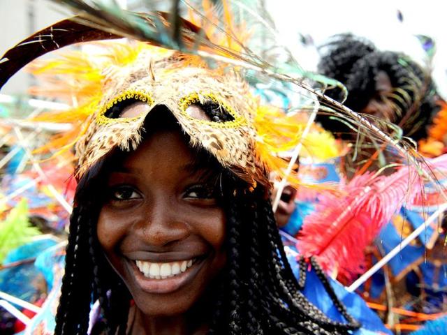 A lady dances in a procession during the yearly Lagos carnival. The yearly Lagos carnival to celebrate the Easter festival and the rich cultural heritage of of the state was held in Lagos metropolis. AFP PHOTO / PIUS UTOMI EKPEI