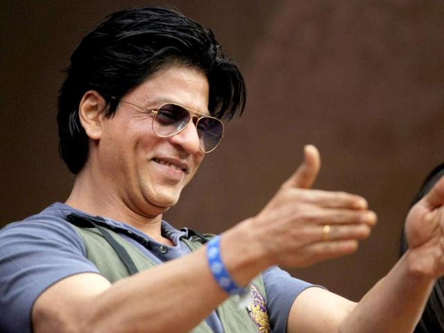 Bollywood actor and Kolkata Knight Riders' owner Shahrukh Khan cheers his team during the IPL 5 match against Royal Challengers Bangalore in Bengalore. PTI Photo/Shailendra Bhojak