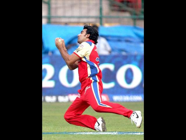 Royal Challengers Bangalore's Zaheer Khan takes the catch off Laxmi Rattan Shukla of Kolkata Knight Riders during their IPL 5 match in Bengaluru. PTI Photo/Shailendra Bhojak