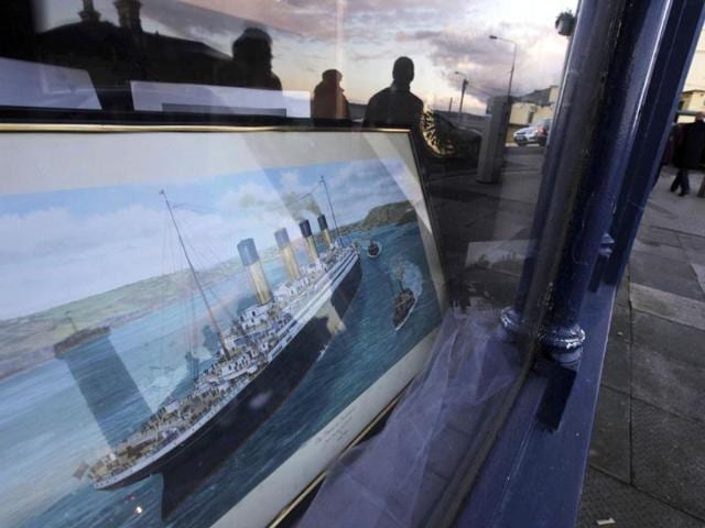 A shop with a window decorated with a painting of the Titanic is seen in Cobh, Ireland. (AP Photo/Lefteris Pitarakis)