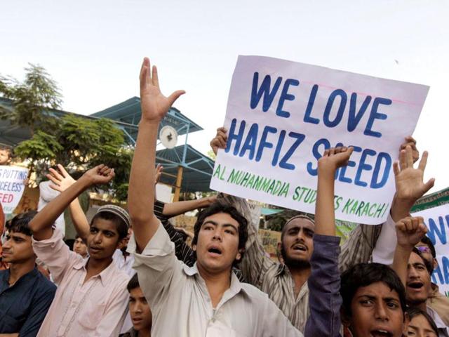 Supporters of Al Muhammadia Students, a religious group, shout slogans while taking part in an anti-American rally in Karachi. Dozens of students gathered in a rally to condemn the American decision to place a $10 million bounty on its leader Hafiz Saeed, the Islamist suspected of masterminding the 2008 Mumbai attack. (Reuters)
