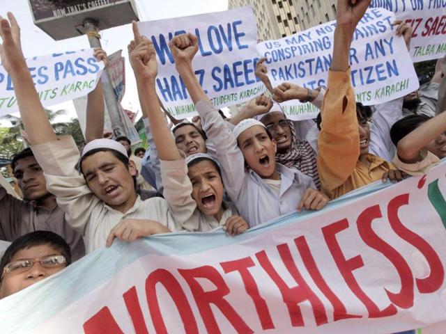 Supporters of Al Muhammadia Students, a religious group, shout slogans while taking part in an anti-American rally in Karachi. Dozens of students gathered in a rally to condemn the American decision to place a $10 million bounty on its leader Hafiz Saeed, the Islamist suspected of masterminding the 2008 Mumbai attack. (Reuters)