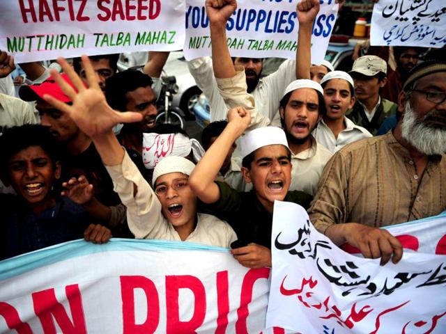 Pakistani religious students of Muttahida Talba Mahaz, shout anti-US slogans during a protest rally in Karachi. Protesters condemned a $10 million bounty slapped on the founder of a terror group. The Defence Council of Pakistan, an alliance of right-wing, religious and extremist groups, organised the rallies to denounce the move against Hafiz Saeed, whose Lashkar-e-Taiba group was blamed for the 2008 Mumbai attacks. (AFP Photo)