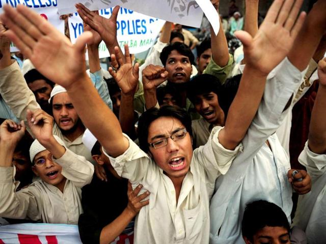 Pakistani religious students of Muttahida Talba Mahaz, shout anti-US slogans during a protest rally in Karachi. Protesters condemned a $10 million bounty slapped on the founder of a terror group. The Defence Council of Pakistan, an alliance of right-wing, religious and extremist groups, organised the rallies to denounce the move against Hafiz Saeed, whose Lashkar-e-Taiba group was blamed for the 2008 Mumbai attacks. (AFP Photo)