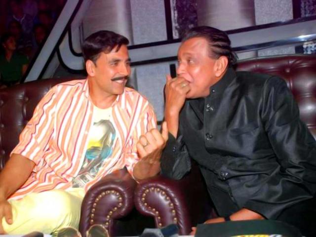 Akshay Kumar shares a light moment with Mithun Chakraborty on the show.