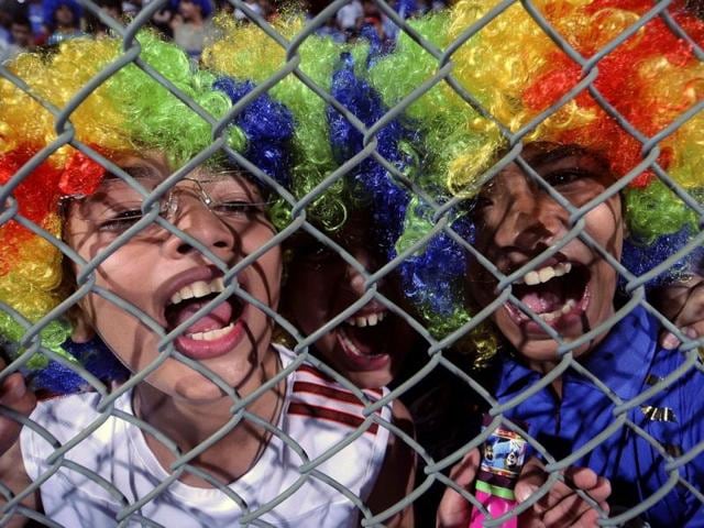 Mumbai Indians supporters cheer before the start of the IPL Twenty20 cricket match between Rajasthan Royals and Mumbai Indians at the Wankhede Stadium in Mumbai .AFP Photo/Indranil Mukherjee