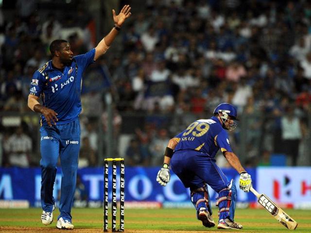 Mumbai Indians bowler Kieron Pollard gestures as Rajasthan Royals batsman Owais Shah takes a run during the IPL Twenty20 cricket match between Rajasthan Royals and Mumbai Indians at the Wankhede Stadium in Mumbai . AFP Photo/Indranil Mukherjee