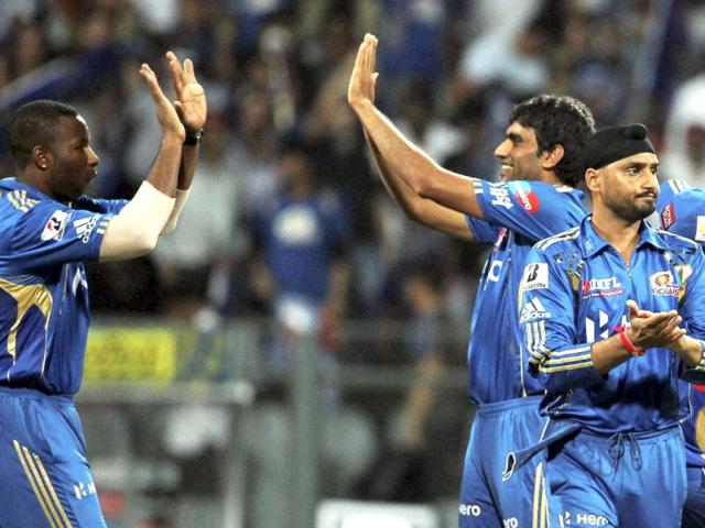 Mumbai Indians players celebrate the wicket of Rajasthan Royals' Rahul Dravid during their IPL-5 match in Mumbai .PTI Photo/Shirish Shete