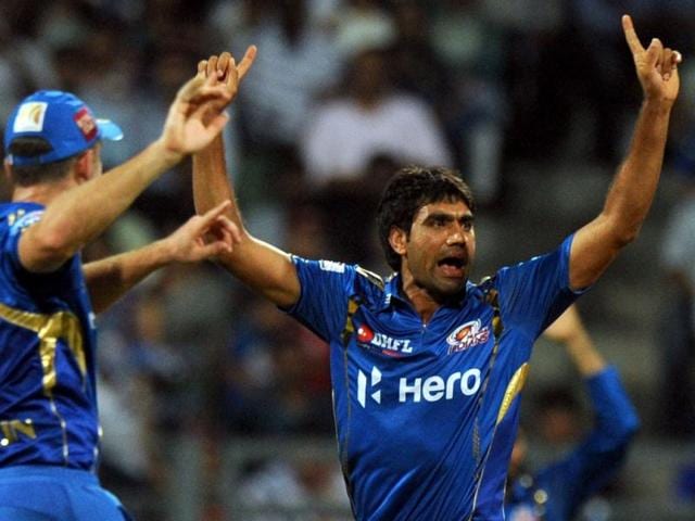 Mumbai Indians bowler Munaf Patel (C) jumps in air as he celebrates the wicket of an unseen Rajasthan Royals batsman during the IPL Twenty20 cricket match between Rajasthan Royals and Mumbai Indians at the Wankhede Stadium in Mumbai . AFP Photo/Indranil Mukherjee