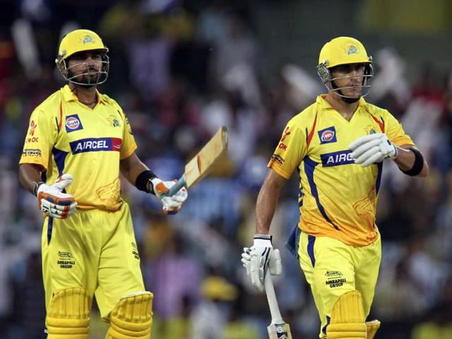 Chennai Super Kings batsmen Murali Vijay (L) and Faf du Plessis (R) gesture during the IPL Twenty20 cricket match between Chennai Super Kings and Royal Challengers Bangalore at The M.A. Chidambaram Stadium in Chennai. AFP Photo/Seshadri Sukumar