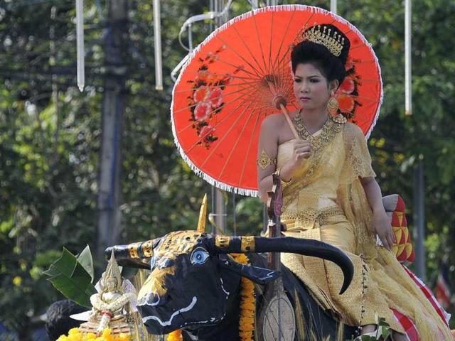 A Thai woman parades on a float as part of celebrations of the Songkran festival marking the Thai new year in Thailand' southern province of Narathiwat. The Thai new year falls on April 13. AFP PHOTO/ MADAREE TOHLALA