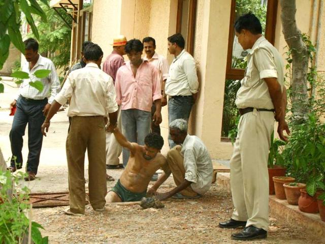 Talwars' family friends Duranis' Nepalese domestic help Rajkumar arrested on the suspicion of involvement in the murder. Series of polygraph test, brain mapping and narco analysis done on Krishna, Rajkumar. (HT photos)