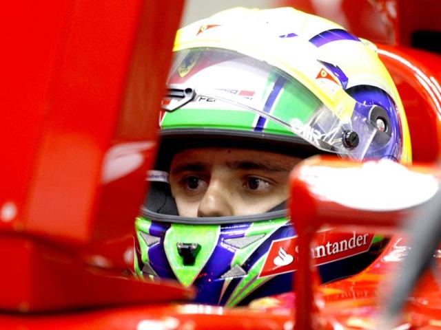 Ferrari Formula One driver Felipe Massa of Brazil waits in his car during practice for the Chinese Grand Prix in Shanghai, China. AP Photo/Mark Baker