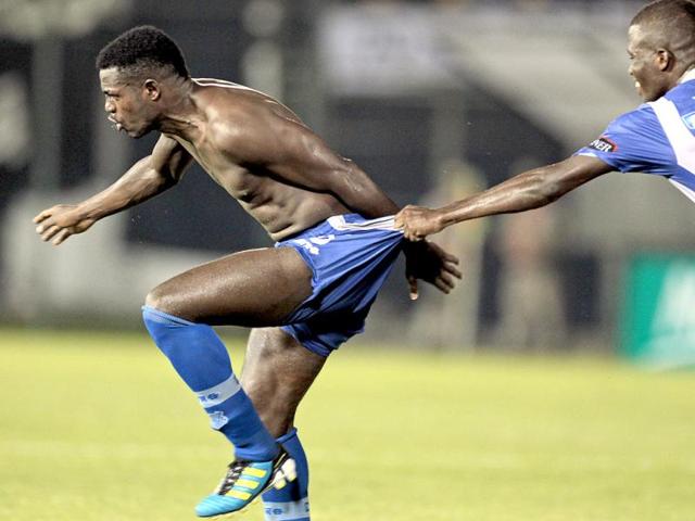 Ecuador's Emelec's Marlon De Jesus, right, is grabbed by teammate Enner Valencia as he celebrates after scoring against Paraguay's Olimpia during a Copa Libertadores soccer game a in Asuncion. Emelec won 3-2. AP Photo/Jorge Saenz
