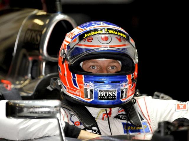 McLaren Mercedes team driver Jenson Button of Britain gets ready for the first practice session for Formula One's Chinese Grand Prix at the Shanghai International Circuit. AFP/Peter Parks