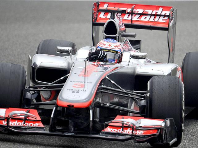 McLaren Mercedes team driver Jenson Button of Britain steers his car during the first practice session of Formula One's Chinese Grand Prix at the Shanghai International Circuit. AFP/Liu Jin