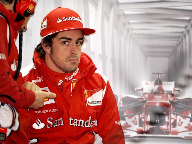 Scuderia Ferrari driver Fernando Alonso of Spain sits in the garage during the first practice session for Formula One's Chinese Grand Prix at the Shanghai International Circuit. AFP/Peter Parks