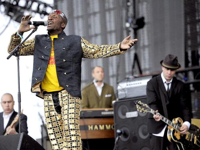 Reggae legend Jimmy Cliff, left, performs onstage with Tim Armstrong, right, during the first weekend of the 2012 Coachella Valley Music and Arts Festival in Indio, California. AP Photo/Chris Pizzello