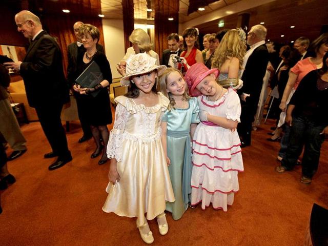 Passengers in costumes and evening dress arrive to a reception prior to the gala dinner in the MS Balmoral Titanic memorial cruise ship, in the Atlantic Ocean. AP Photo/Lefteris Pitarakis