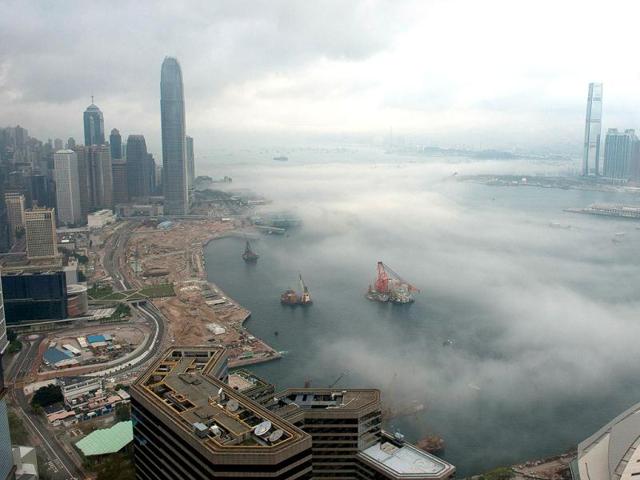 Morning fog rises off Victoria Harbor in Hong Kong. AFP Photo/ Antony Dickson