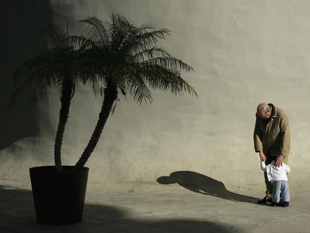An elderly man hugs a boy in the Andalusian capital of Seville. Reuters/Marcelo del Pozo