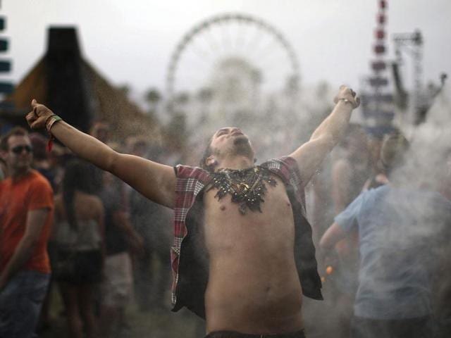 A man dances as he is hosed with water at the Do Lab at the Coachella Valley Music and Arts Festival in Indio, California. (Reuters/David McNew)