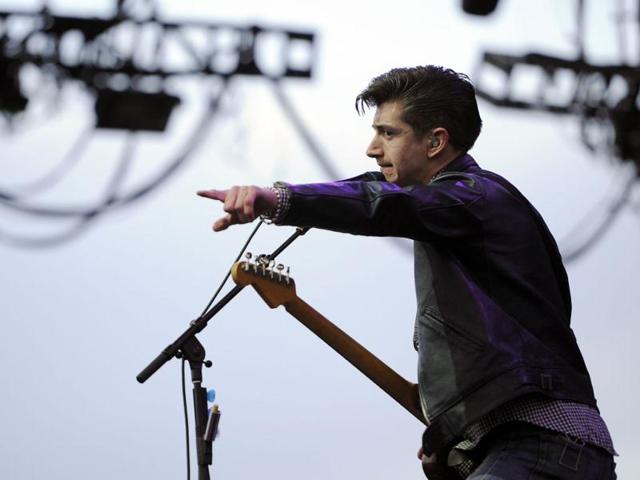 Alex Turner of the British band Arctic Monkeys performs during the first weekend of the 2012 Coachella Valley Music and Arts Festival in Indio, California. (AP Photo/Chris Pizzello)