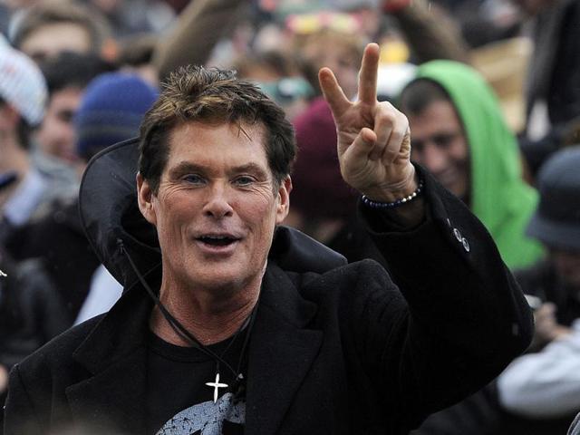 David Hasselhoff poses for fans as he stands in the crowd during the first weekend of the 2012 Coachella Valley Music and Arts Festival in Indio, California. (AP Photo/Chris Pizzello)