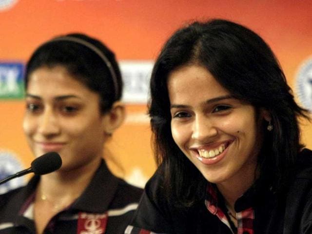 Shuttlers Ashwani Ponnappa and Saina Nehwal (R) at a press conference ahead of the second edition of Yonex-Sunrise India Open 2012 OSIM BWF World Superseries badminton tournament in New Delhi. HT Photo/M Zhazo
