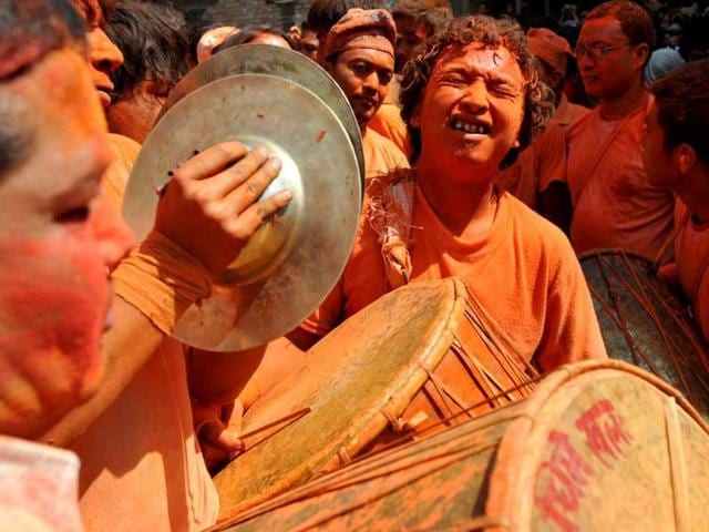 Nepalese youths play traditional music during The Bisket Jatra Festival at Thimi on the outskirts of Kathmandu. The traditional Bisket Jatra festival is celebrated during the Nepali New Year. AFP PHOTO/ Prakash MATHEMA