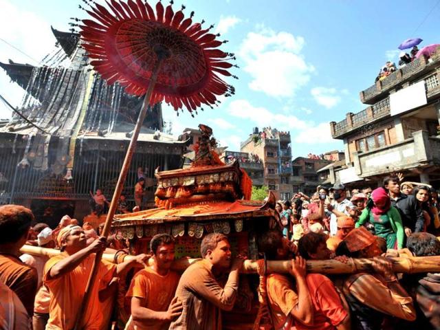 Nepalese youths play traditional music during The Bisket Jatra Festival at Thimi on the outskirts of Kathmandu. The traditional Bisket Jatra festival is celebrated during the Nepali New Year. AFP PHOTO/ Prakash MATHEMA